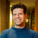 Smartphone taking a clear photo of a skin condition on a person’s arm in natural lighting, demonstrating how to capture images for an online dermatology consultation.